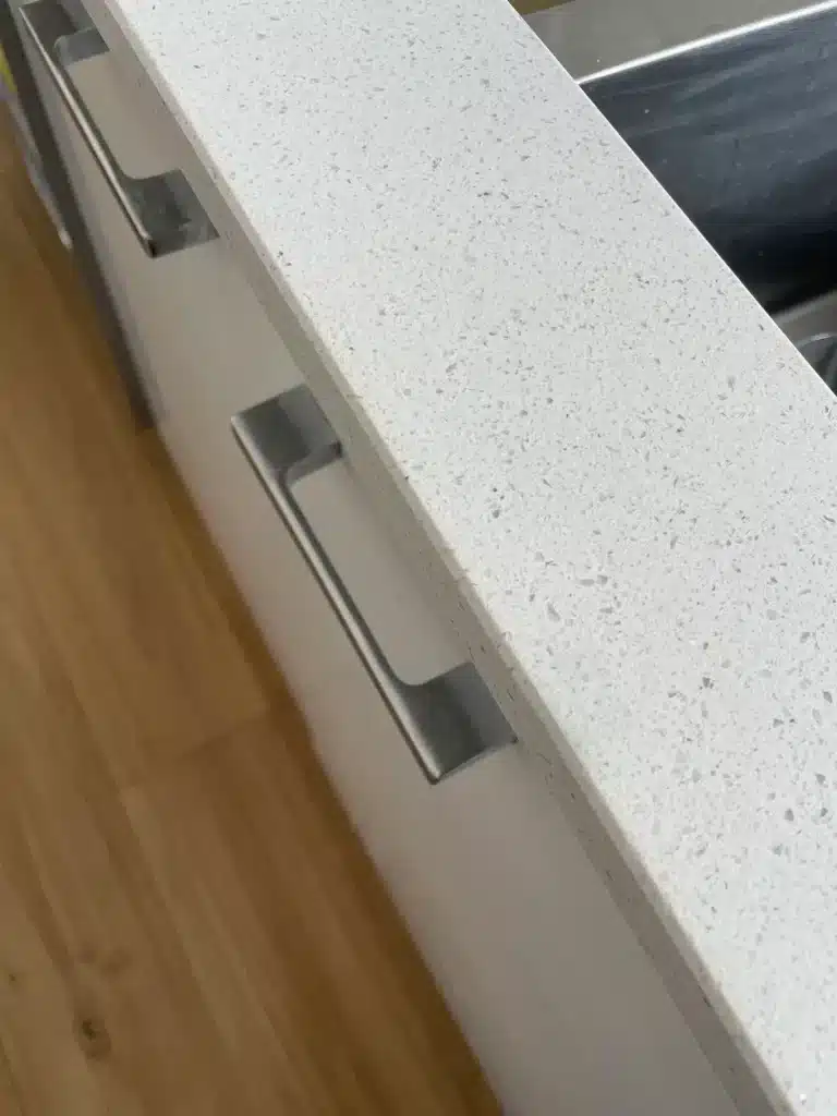 Chipped countertop edge repaired — after