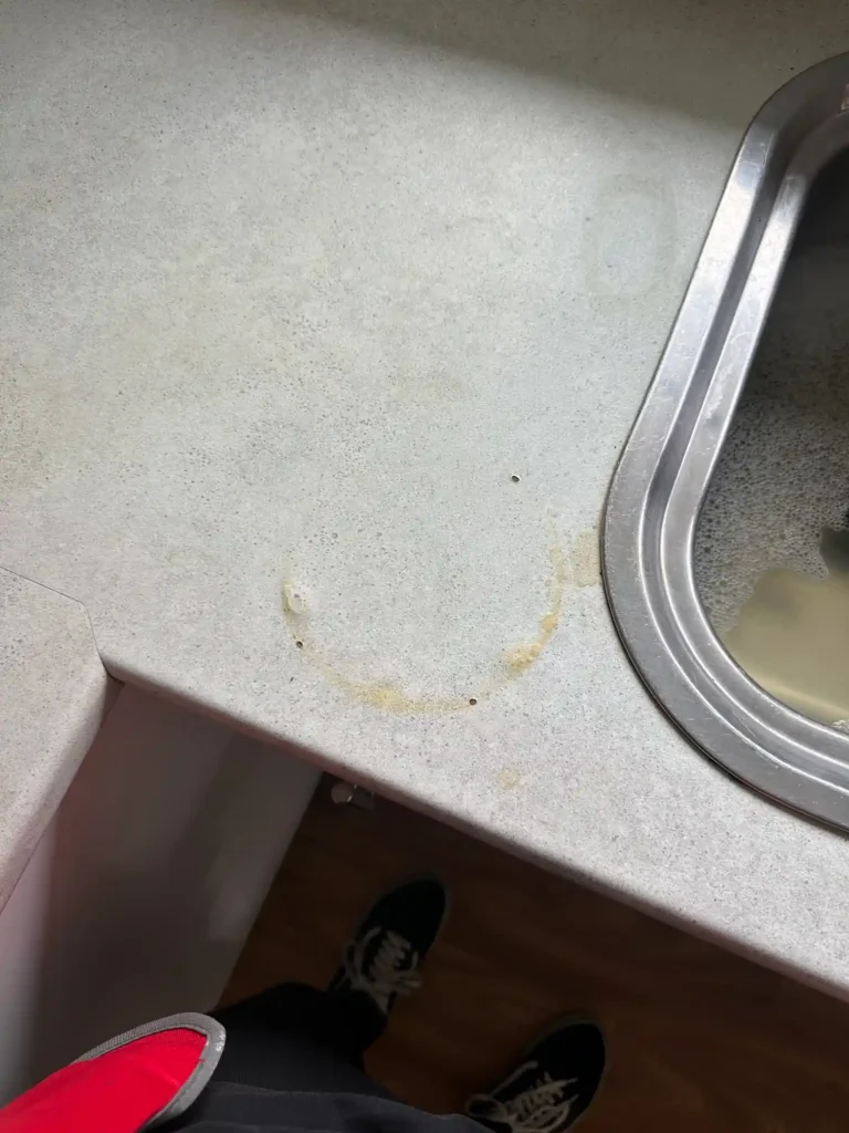 Countertop heat mark treated — before
