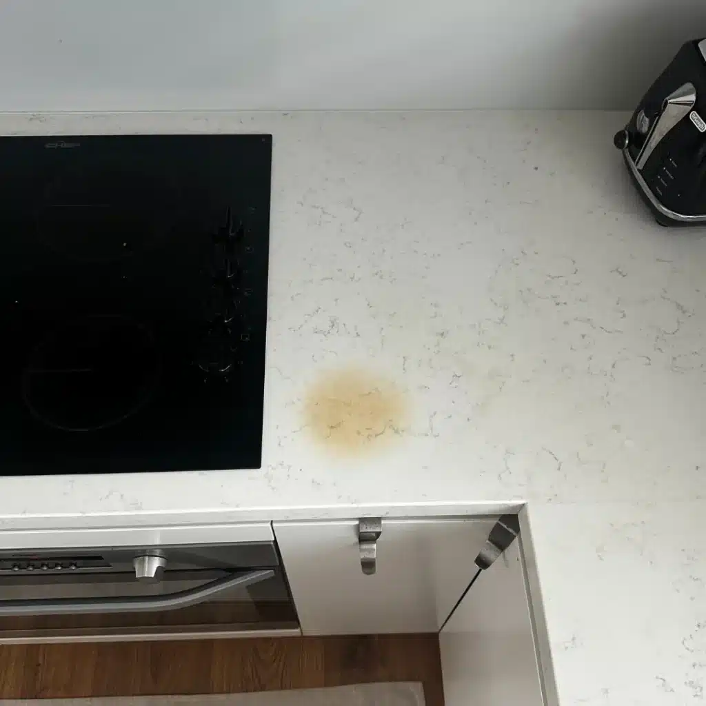 Heat mark on a light countertop repaired — before
